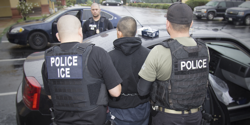 ICE officers making an arrest